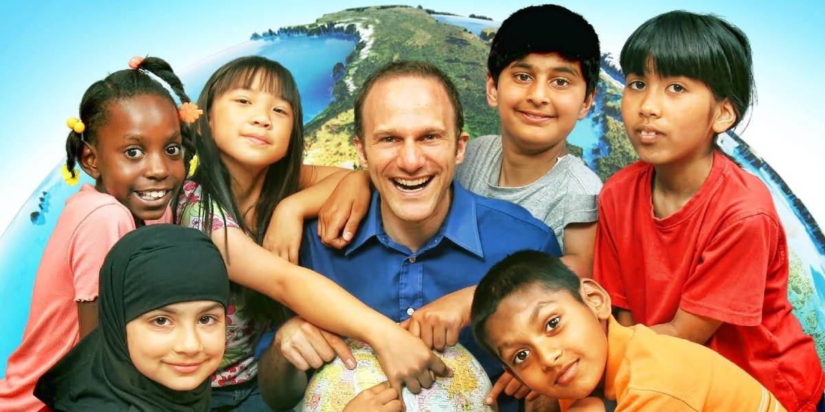 Chris McKhool with children and a globe